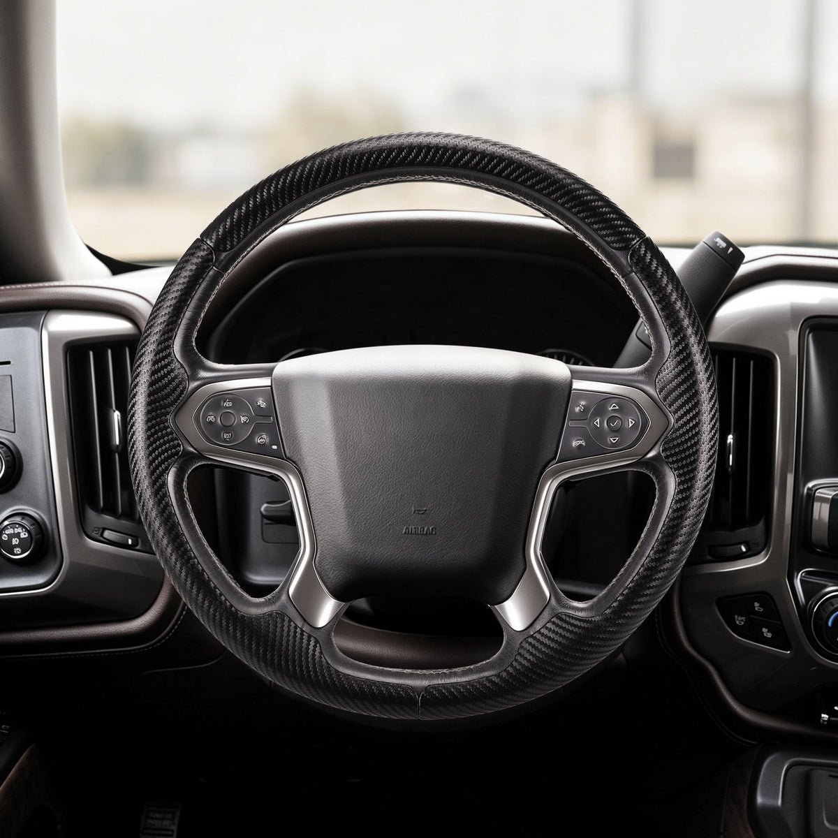 Front installed view of matte black carbon-fiber-style 3-piece steering wheel cover for Chevy Silverado 1500 2014-2018