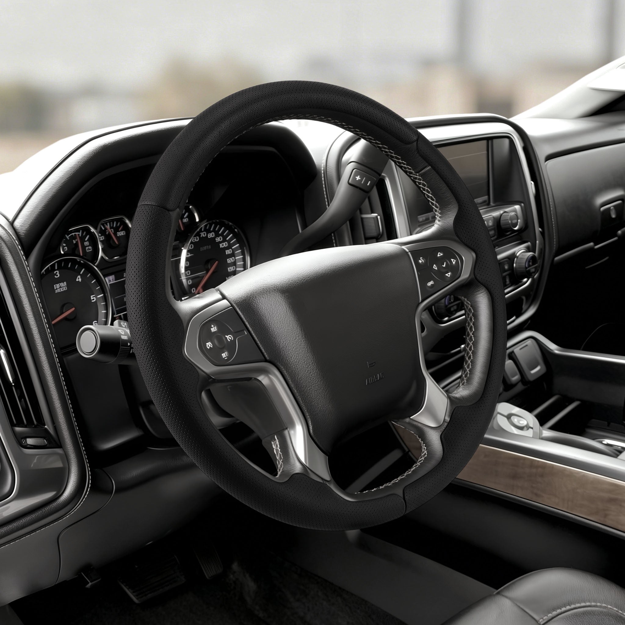 Angled installed view of matte black carbon-fiber-style 3-piece steering wheel cover for Chevy Silverado 1500 2014-2018
