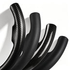 Close-up comparison of black leather and black carbon-fiber-style 3-piece steering wheel cover finishes for Dodge Ram 1500/2500/3500/4500/5500 2012-2018 & RAM 1500 Classic 2019-2023#color=black