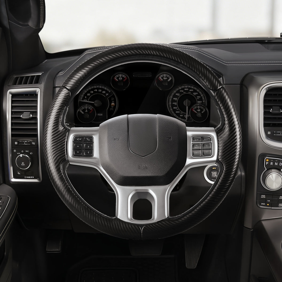 Front installed view of matte black carbon-fiber-style 3-piece steering wheel cover for Dodge Ram 1500 2012-2018
