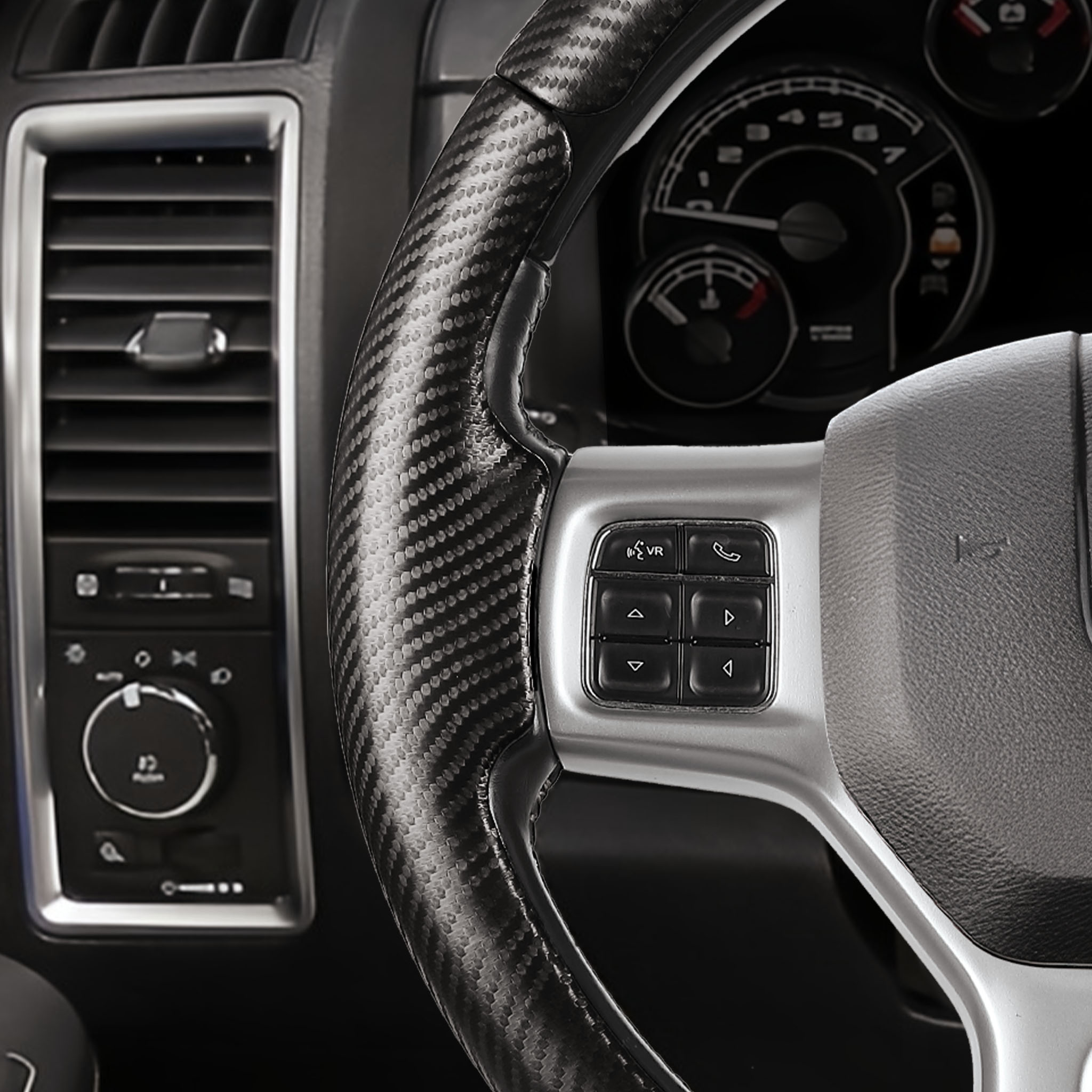 Close-up of a matte black carbon-fiber-style 3-piece steering wheel cover for Ford Dodge Ram 1500 2012-2018, showing its precise custom fit