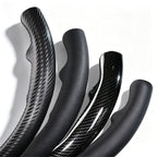 Close-up comparison of leather and carbon-fiber-style 3-piece steering wheel cover finishes for Ford F-150 2015-2020 & F-250/F-350/F-450/F-550 2017-2021#color=black perforated leather