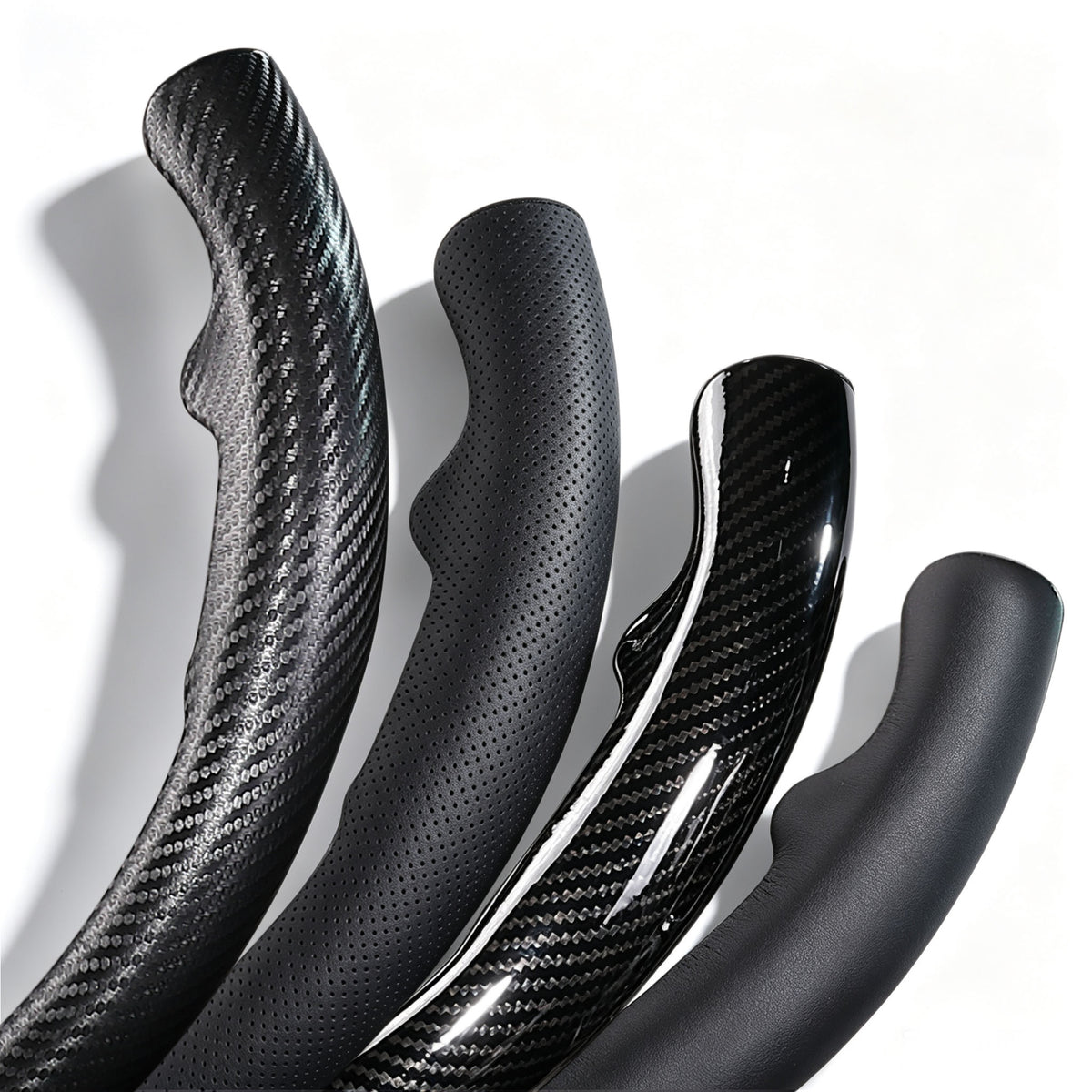 Close-up comparison of leather and carbon-fiber-style 3-piece steering wheel cover finishes for Ford F-150 2015-2020 & F-250/F-350/F-450/F-550 2017-2021#color=black perforated leather