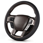 Angled front view of black perforated leather 3-piece steering wheel cover for Ford F-150 2015-2020 & F-250/F-350/F-450/F-550 2017-2021#color=black perforated leather