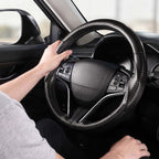 Installed view of matte black carbon-fiber-style 3-piece steering wheel cover for Honda Civic 2016-2021 & Clarity 2018-2021 with driver holding the wheel#color=matte black