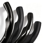 Close-up comparison of black leather and black carbon-fiber-style 3-piece steering wheel cover finishes for Jeep Wrangler 2018-2026#color=black