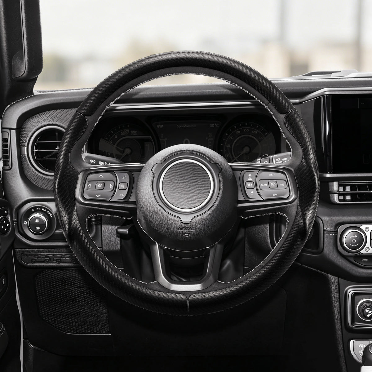 Front installed view of matte black carbon-fiber-style 3-piece steering wheel cover for Jeep Wrangler 2018-2026