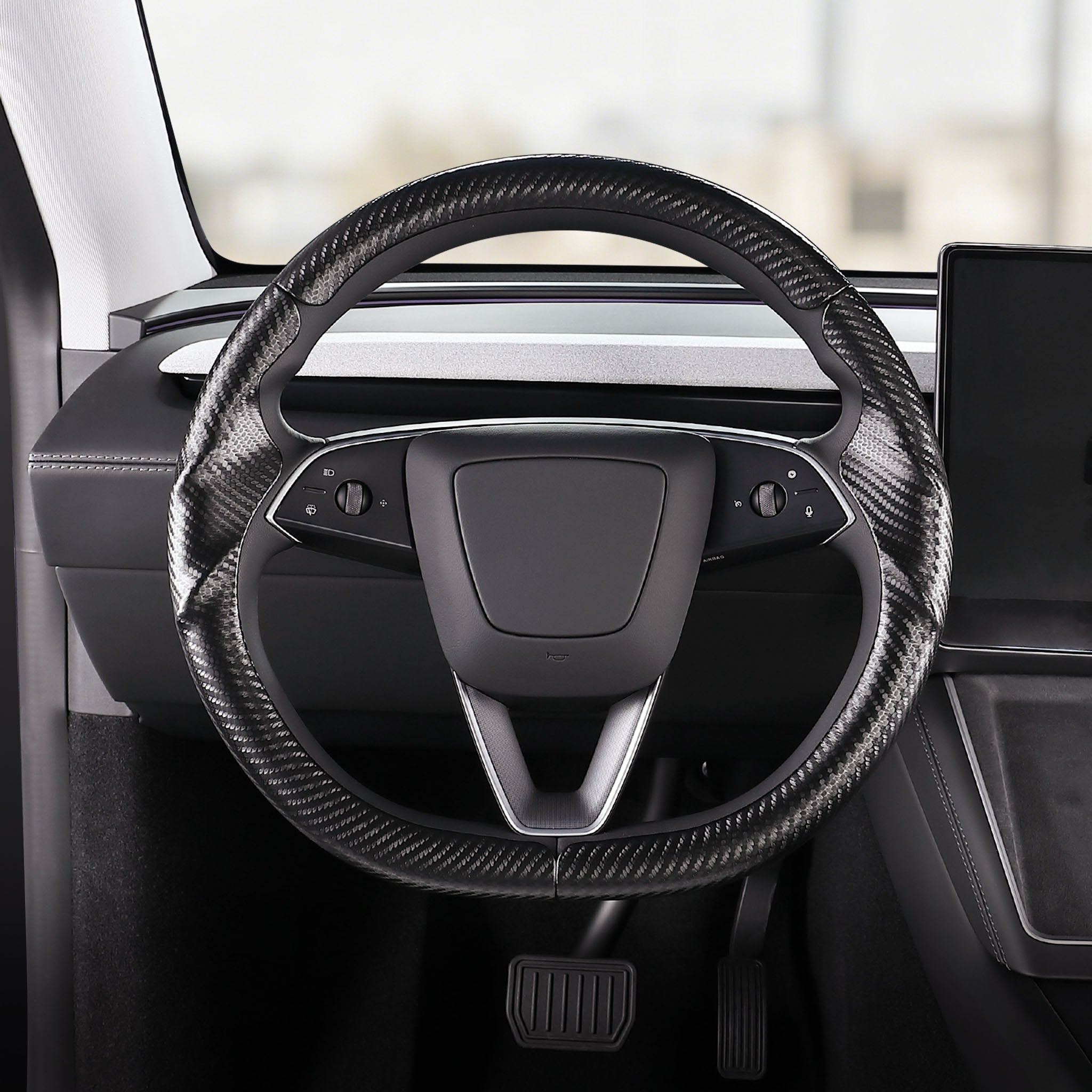 Front installed view of matte black carbon-fiber-style 3-piece steering wheel cover for Tesla Model 3 2024-present