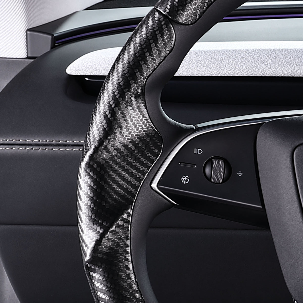 Close-up of a matte black carbon-fiber-style 3-piece steering wheel cover for Tesla Model 3 2024-present, showing its ergonomic 3D contours and precise custom fit