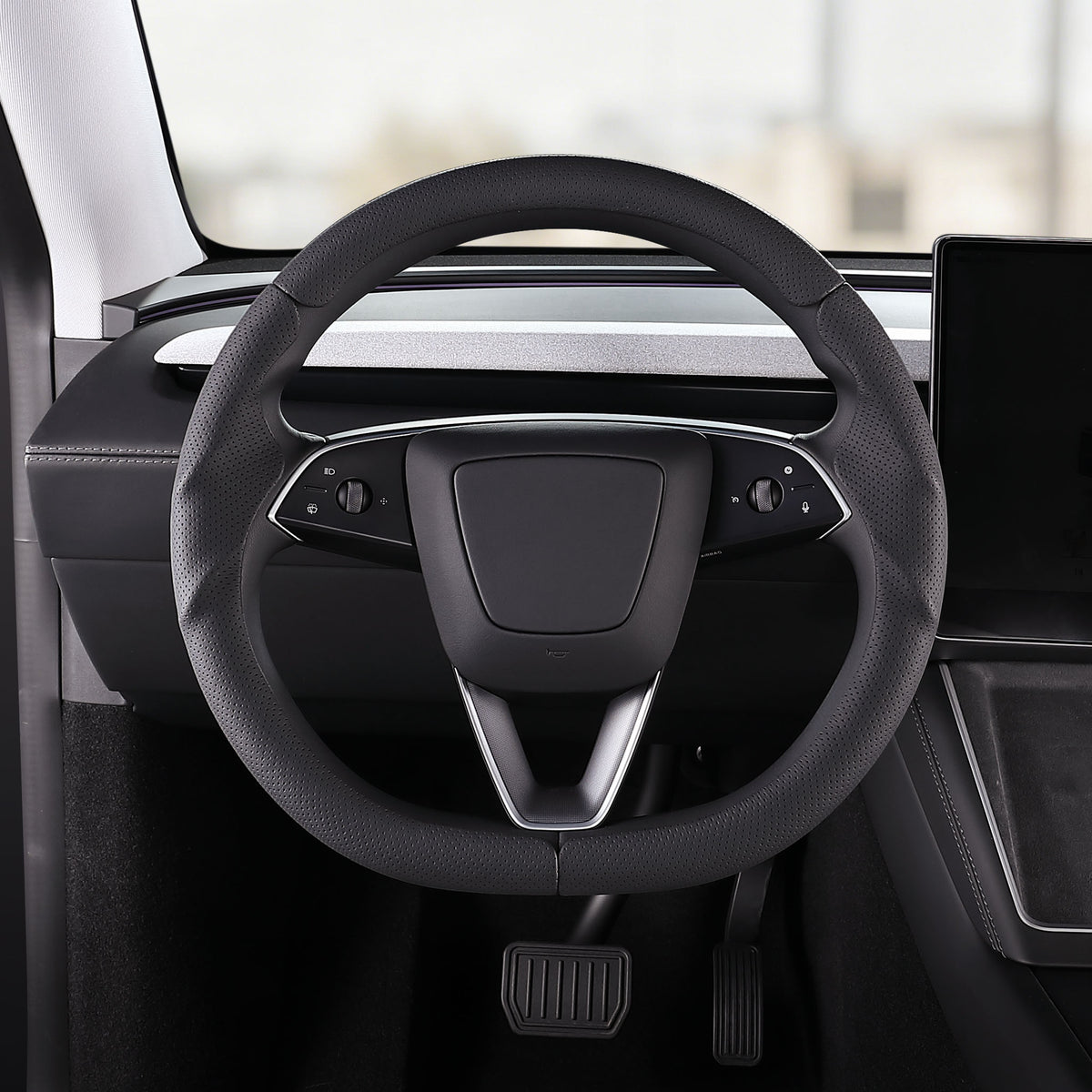 Front installed view of black perforated leather 3-piece steering wheel cover for Tesla Model 3 2024-present
