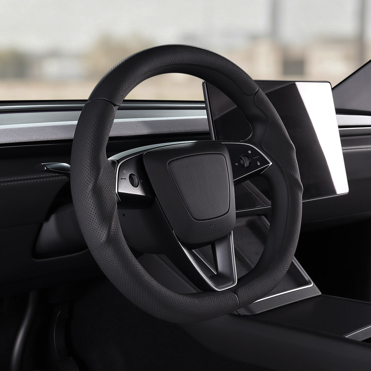Angled installed view of black perforated leather 3-piece steering wheel cover for Tesla Model 3 2024-present