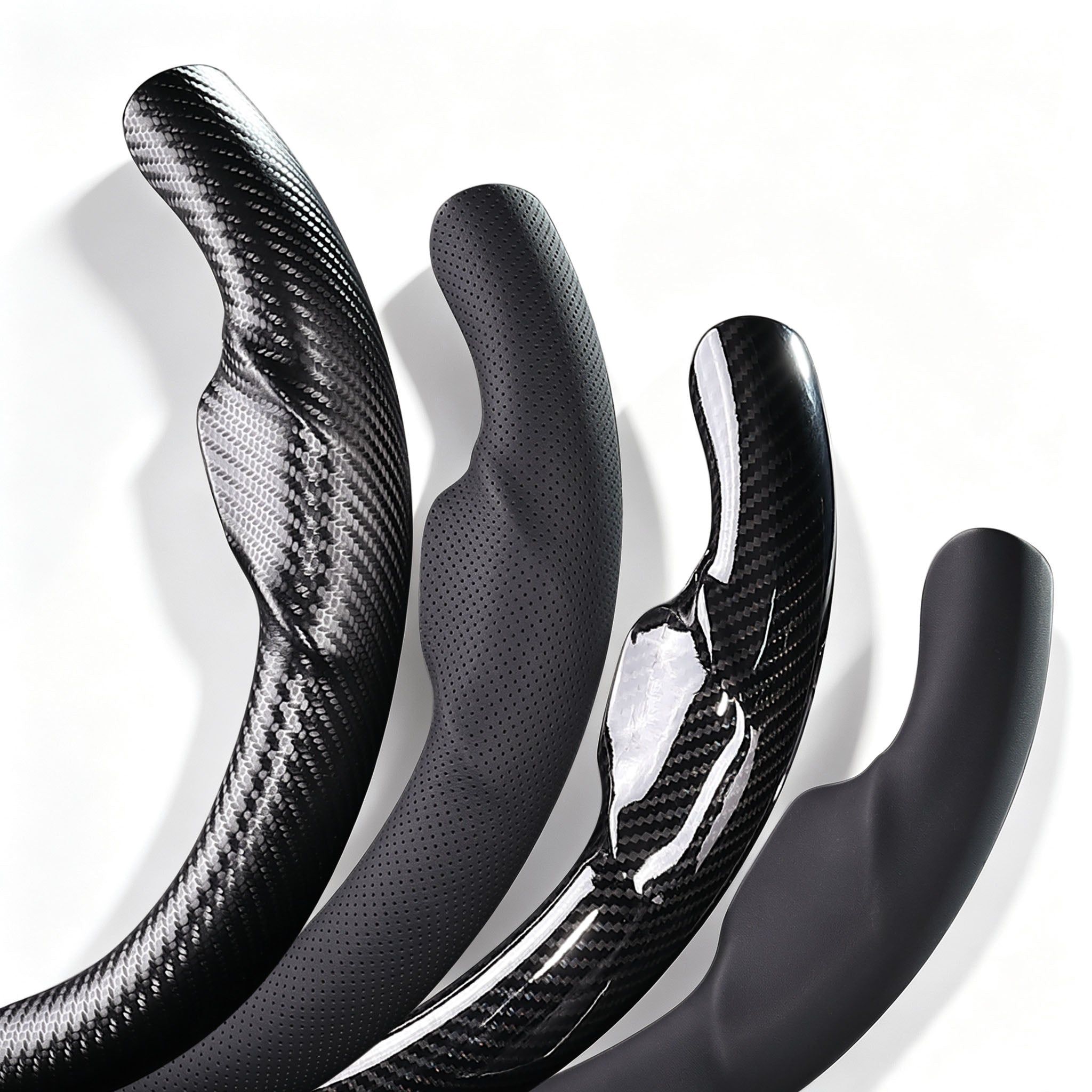 Close-up comparison of black leather and black carbon-fiber-style 3-piece steering wheel cover finishes for Tesla Model 3 2017-2023#Model=Model 3 2017-2023|color=black