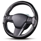 Angled front view of matte black carbon-fiber-style 3-piece steering wheel cover for Tesla Model 3 2017-2023#Model=Model 3 2017-2023|color=matte black