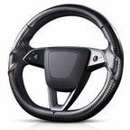 Angled front view of matte black carbon-fiber-style 3-piece steering wheel cover for Tesla Model Y 2025-present#Model=Model Y 2025-present|color=matte black