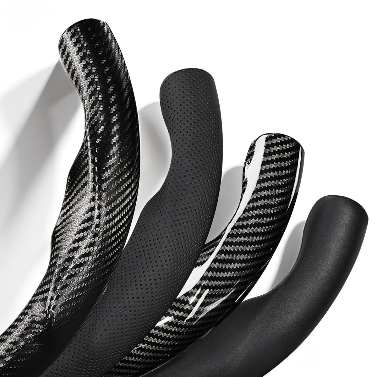 Close-up comparison of black leather and black carbon-fiber-style 3-piece steering wheel cover finishes for Toyota Camry 2015-2017 & Camry SE 2012-2014#color=black