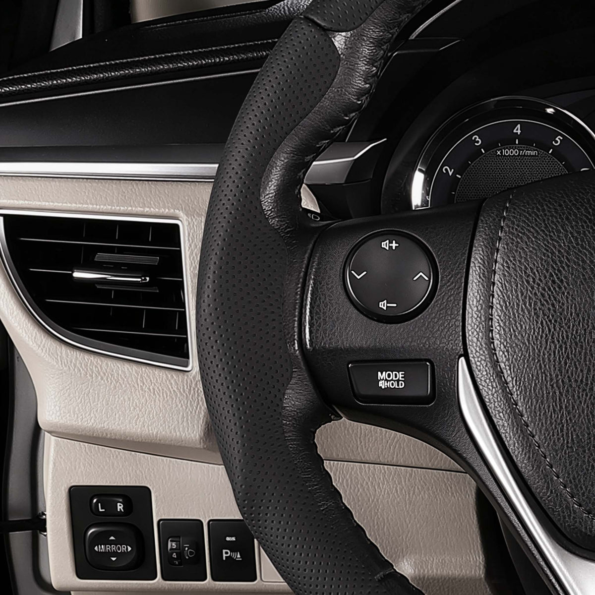 Close-up of a black perforated leather 3-piece steering wheel cover for Toyota Camry 2015-2017, showing its ergonomic 3D contours and precise custom fit