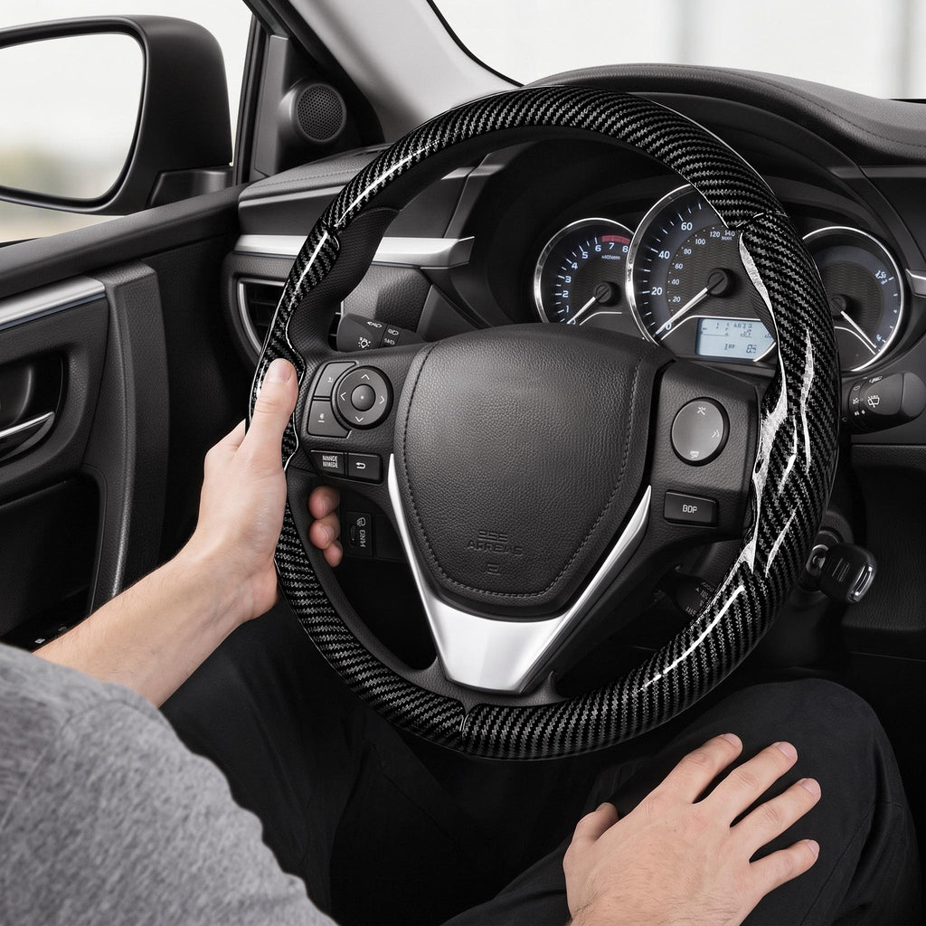 Installed view of glossy black carbon-fiber-style 3-piece steering wheel cover for Toyota Corolla 2014-2019 with driver holding the wheel#color=glossy black