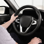 Installed view of matte black carbon-fiber-style 3-piece steering wheel cover for 14.5-15 Inch Wheels with driver holding the wheel#color=matte black