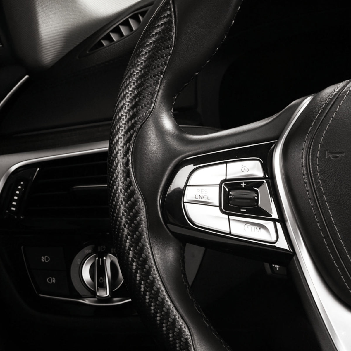 Close-up of a matte black carbon-fiber-style 3-piece steering wheel cover for 14.5-15 Inch Wheels
