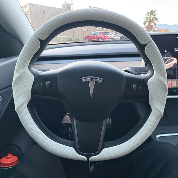 Customer installed LOPHNIX steering wheel cover on Tesla vehicle interior