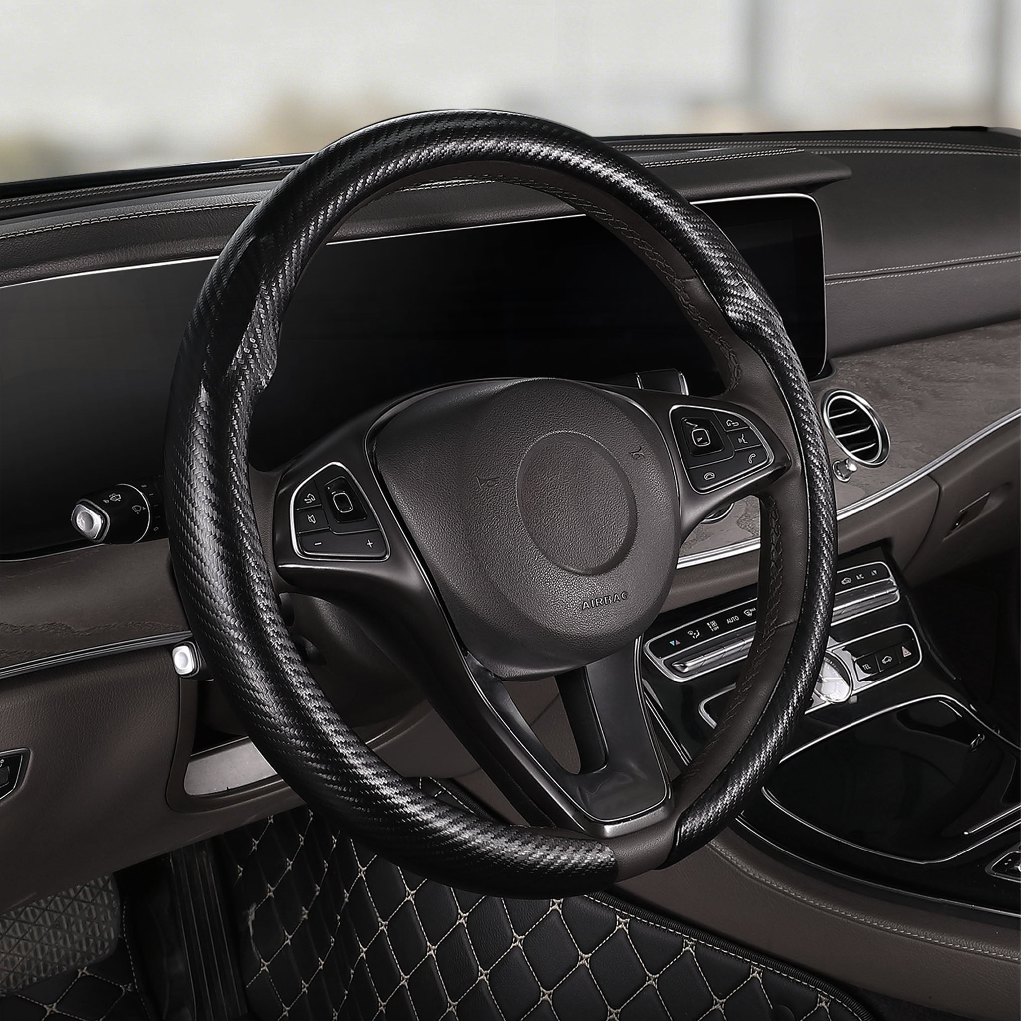 Cockpit view of matte black carbon-fiber-style steering wheel cover for 14.5-15 Inch Wheels