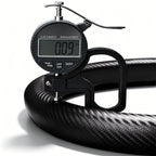 Digital thickness gauge showing the 0.09-inch ultra-slim profile of a matte black carbon-fiber-style steering wheel cover#color=matte black