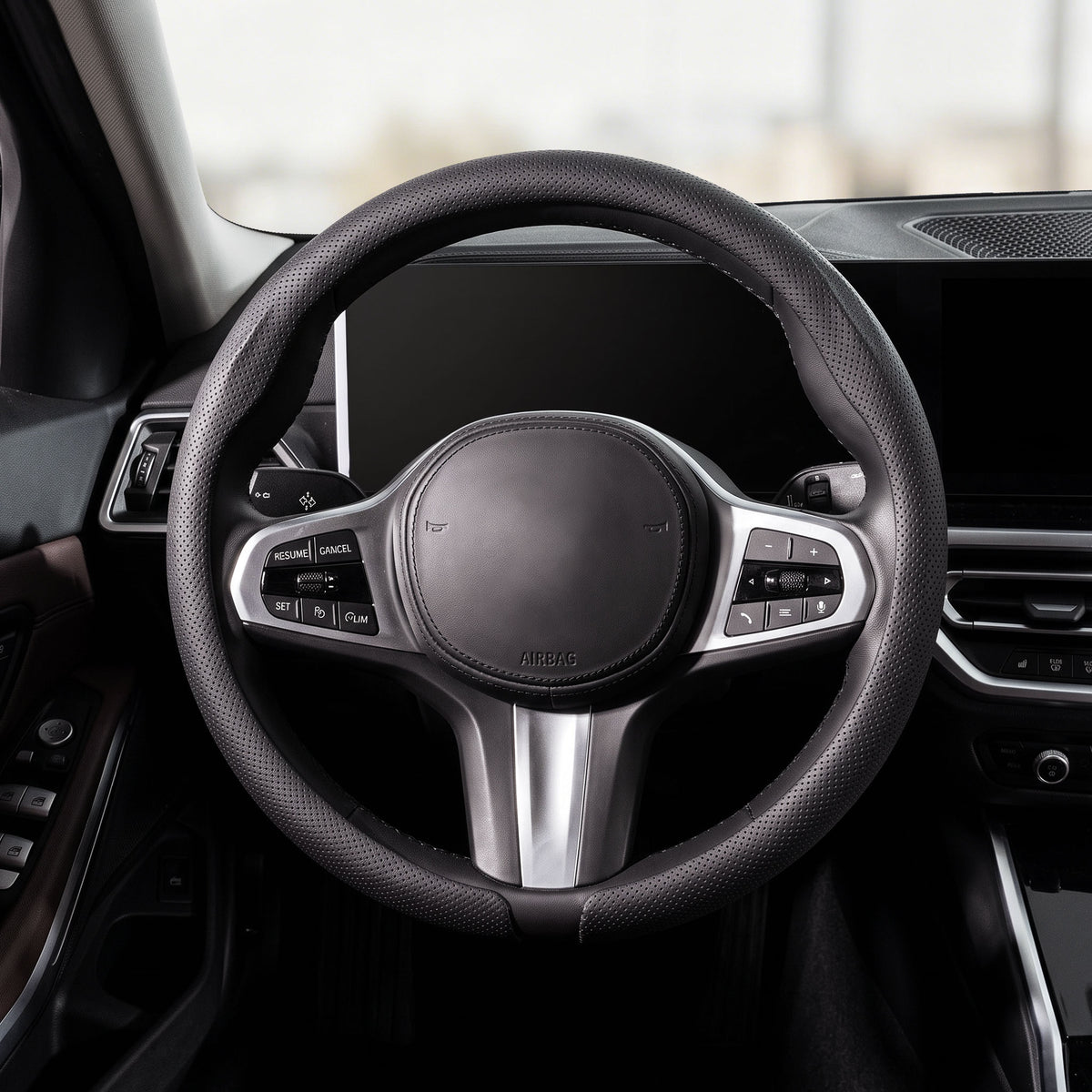 Front installed view of black perforated leather steering wheel cover for 14.5-15 Inch Wheels